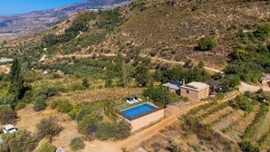 A villa with a swimming pool, surrounded by a hilly landscape and sparse vegetation. - El Cerrillo - Cerro Negro by Interhome (Orgiva)