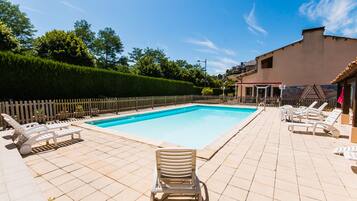 Seasonal outdoor pool, open 11:00 AM to 7:00 PM, sun loungers