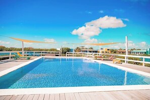 Pool - Comfortable condo with lagoon-view balcony, WiFi, AC & pool access (San Pedro)