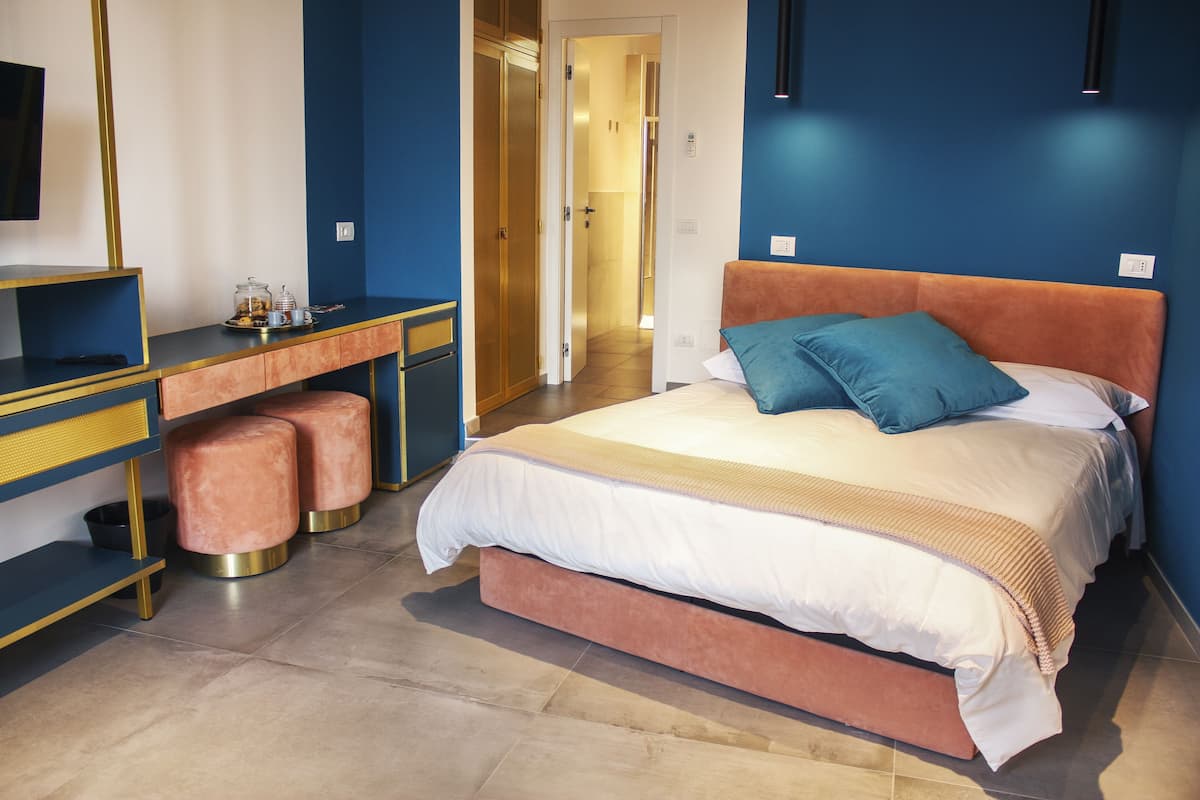 Hypo-allergenic bedding, down duvets, pillow-top beds, in-room safe