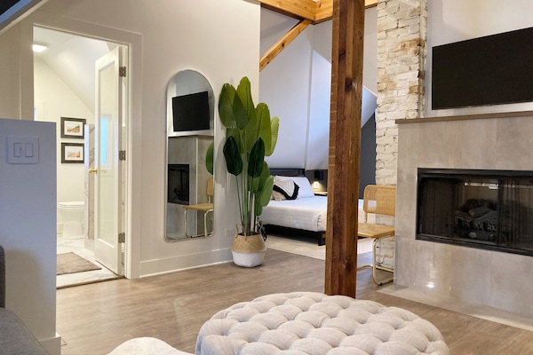 Attic en-suite, smart TV, gas fireplace, dry bar, walk in shower, heated floors