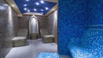Experience the celestial ambiance in this room, featuring a starry night sky ceiling, mosaic tile walls, and a decorative central piece.
