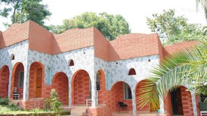 A building with multiple arched doorways and a stone facade.