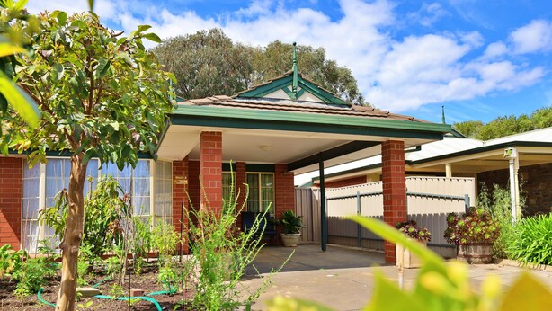 A residential building with a green roof, brick walls, and a covered porch. - ParkViewAtMontagueFarm (Pooraka)
