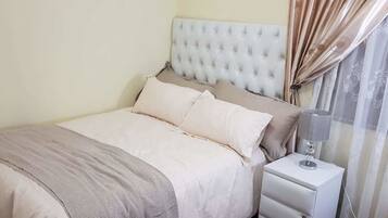 Blackout curtains, iron/ironing board, free WiFi, bed sheets