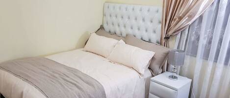 Blackout curtains, iron/ironing board, free WiFi, bed sheets