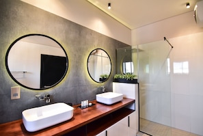 Deluxe Studio | Bathroom | Shower, rainfall showerhead, designer toiletries, hair dryer