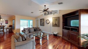 House, Multiple Beds (938 SW 6th Ct) | Living area | Flat-screen TV, DVD player, streaming services - 938 SW 6th Ct (Cape Coral)