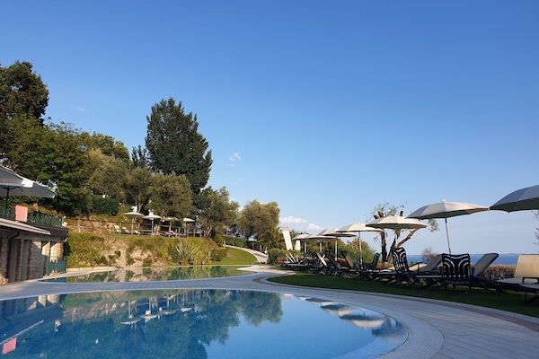 Outdoor pool, pool umbrellas, sun loungers