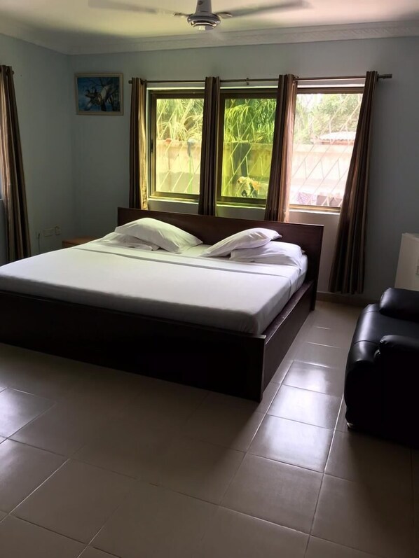 Desk, iron/ironing board, bed sheets