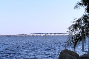 A bridge over water with a clear view of the skyline in the background. - 3513 SW 29th Ave (Cape Coral)