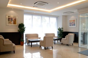 A modern lobby with a seating area, large windows, and artwork on the walls. - Ab Hotel Mikawa Anjo Minamikan (Anjo)