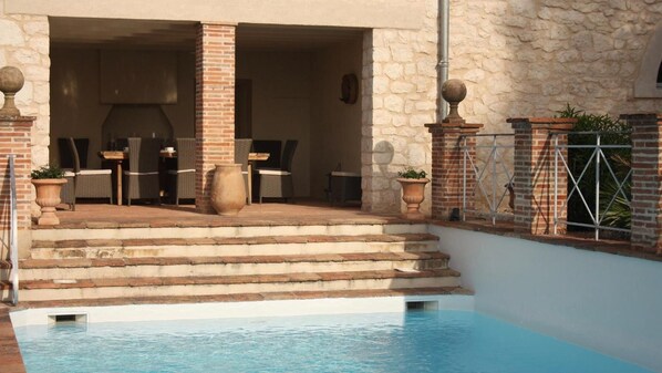 Seasonal outdoor pool, pool umbrellas, pool loungers