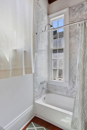 Combined shower/bathtub, hair dryer, towels, soap