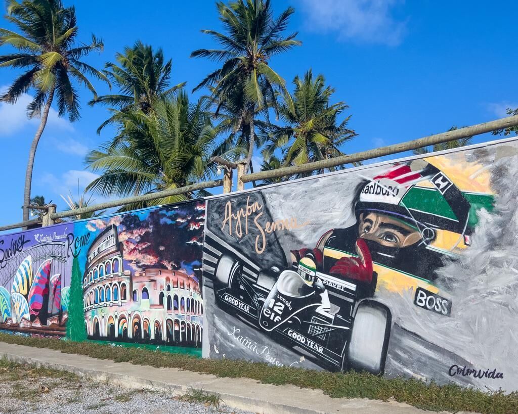 A mural with a racing car and a driver's helmet.
