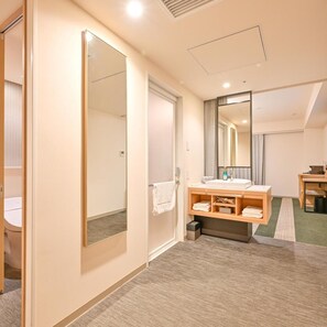 A hotel room with a large mirror, a vanity with a sink, a small table, and a carpeted floor. - Richmond Hotel Tenjin Nishi-Dori (Fukuoka)