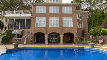 Seasonal outdoor pool, open 9:00 AM to 11:00 PM, pool umbrellas