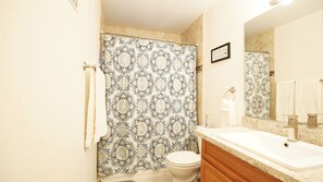 Combined shower/bathtub, hair dryer, towels, soap