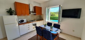 Basic Apartment, 1 Bedroom, Smoking, Garden View | Private kitchen | Full-sized fridge, microwave, oven, stovetop - Sunny Estate (Nin)