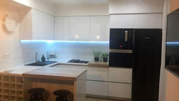Luxury Apartment, Pool View | Private kitchen | Full-sized fridge, microwave, oven, stovetop