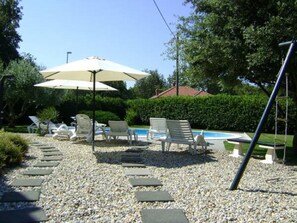 Seasonal outdoor pool, pool umbrellas, pool loungers
