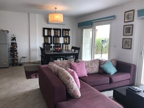 Apartment, 3 Bedrooms | Living area | Flat-screen TV