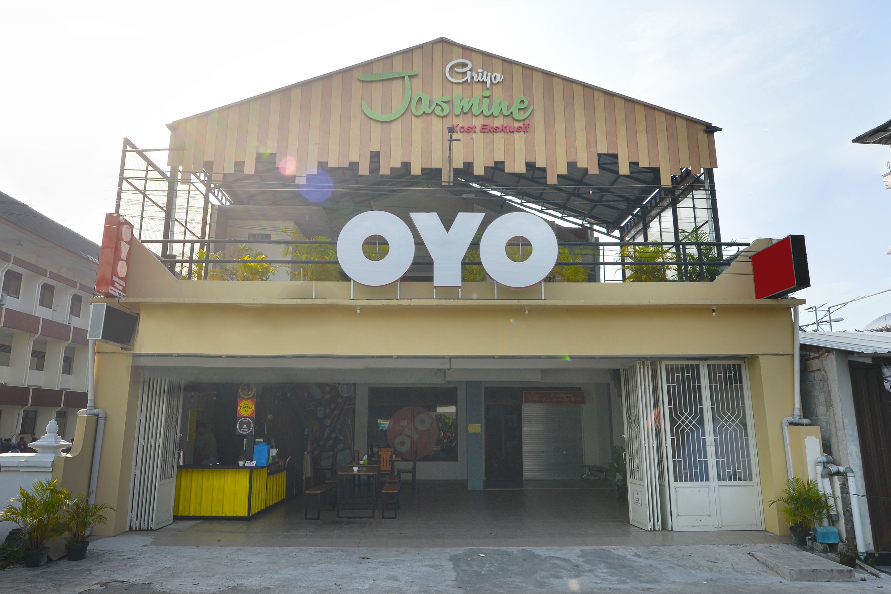 A building with a sign reading "Jasmine" and "OYO" on the facade.