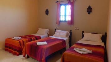 Triple Room | Blackout drapes, bed sheets