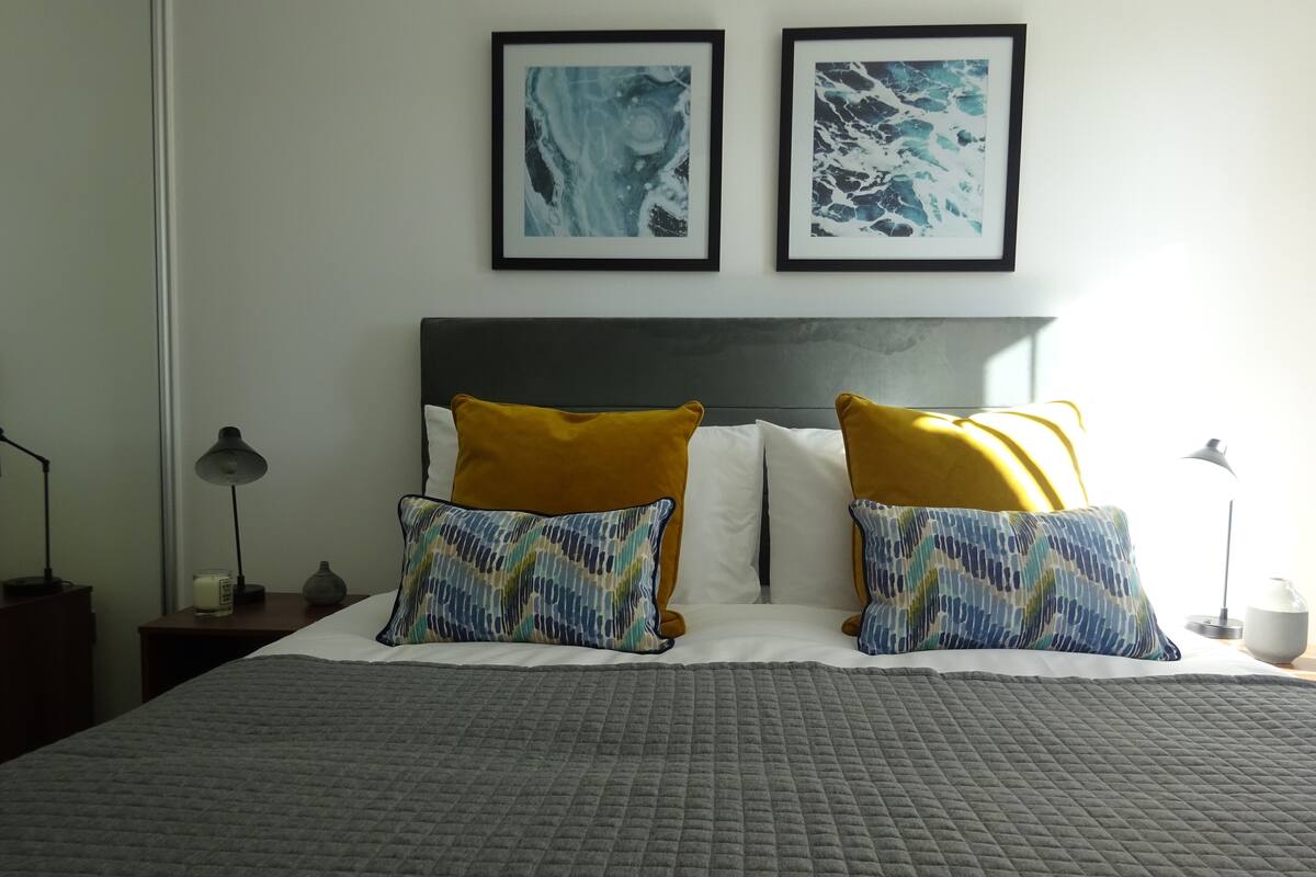 Egyptian cotton sheets, premium bedding, laptop workspace
