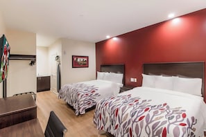 A hotel room with two beds, a desk, a chair, a TV, and a bathroom. - Red Roof Inn Houston - Willowbrook (Houston)