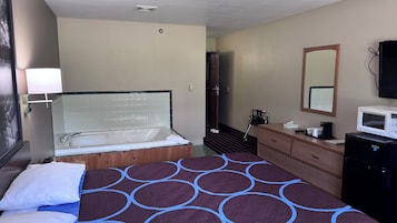 Suite, 1 Queen Bed, Jetted Tub | Desk, laptop workspace, blackout drapes, free WiFi