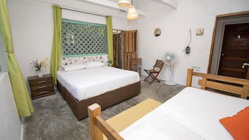 Habitación cuádruple Confort | Ropa de cama