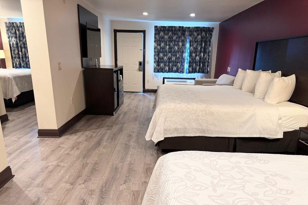 Suite, Multiple Beds, Non Smoking | Desk, laptop workspace, blackout drapes, iron/ironing board