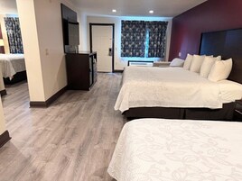 Suite, Multiple Beds, Non Smoking | Desk, laptop workspace, blackout drapes, iron/ironing board