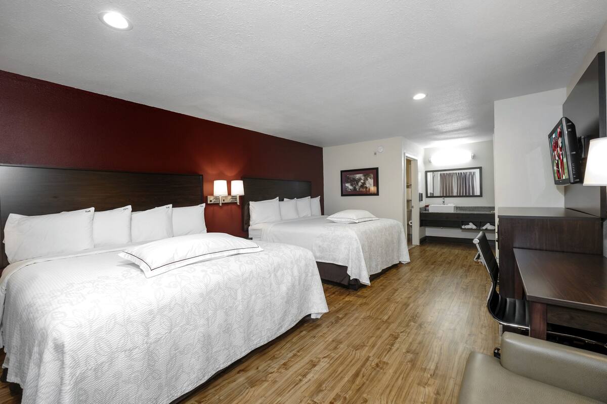 Premium Room, 2 Queen Beds (Upgraded Bedding & Snack, Smoke Free) | Desk, laptop workspace, blackout curtains, iron/ironing board