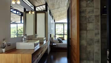 Exclusive Studio Suite, 1 King Bed, Ocean View | Bathroom | Shower, rainfall showerhead, eco-friendly toiletries, towels