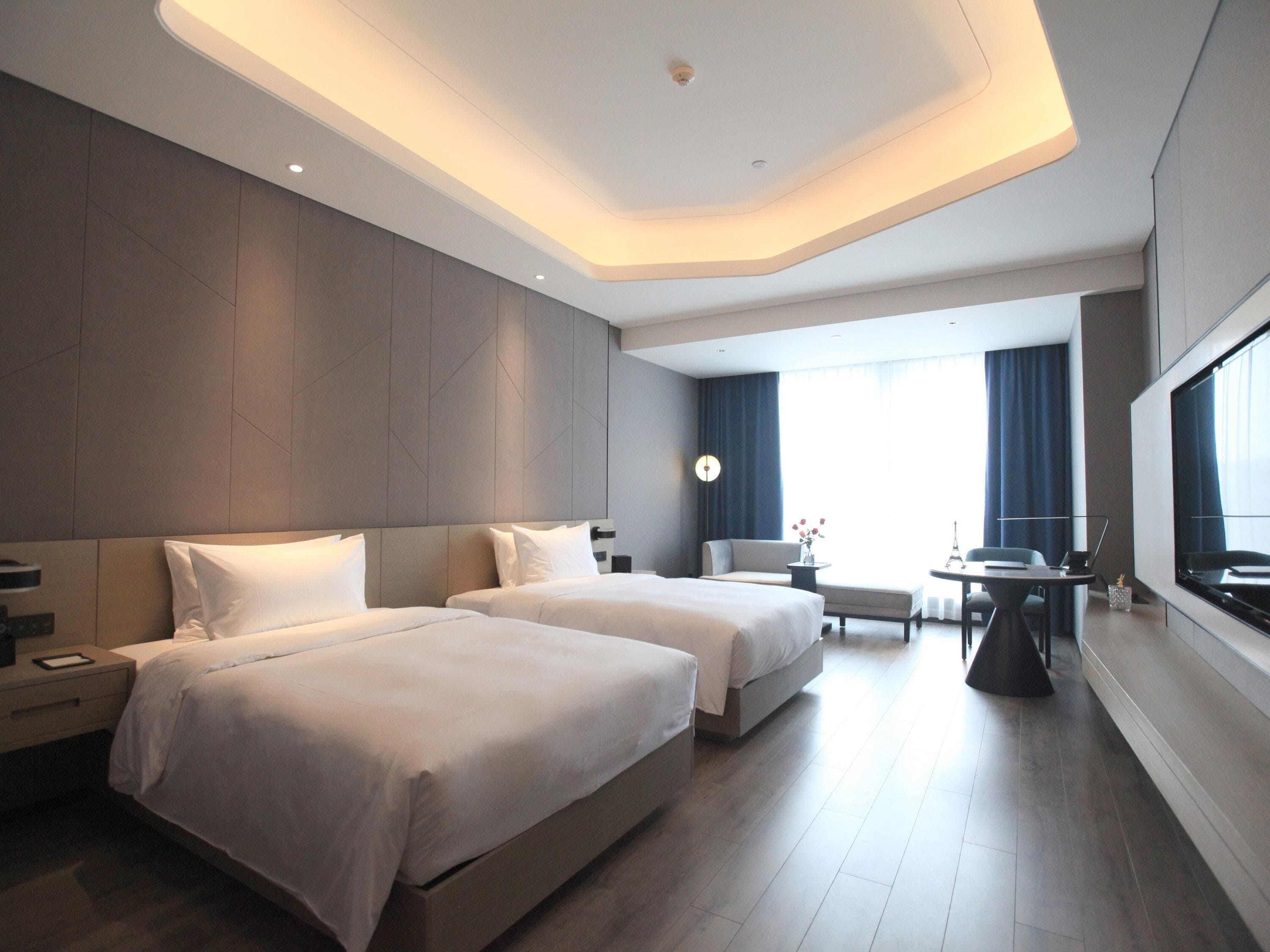 Deluxe Room, 2 Twin Beds | In-room safe, individually decorated, individually furnished, desk
