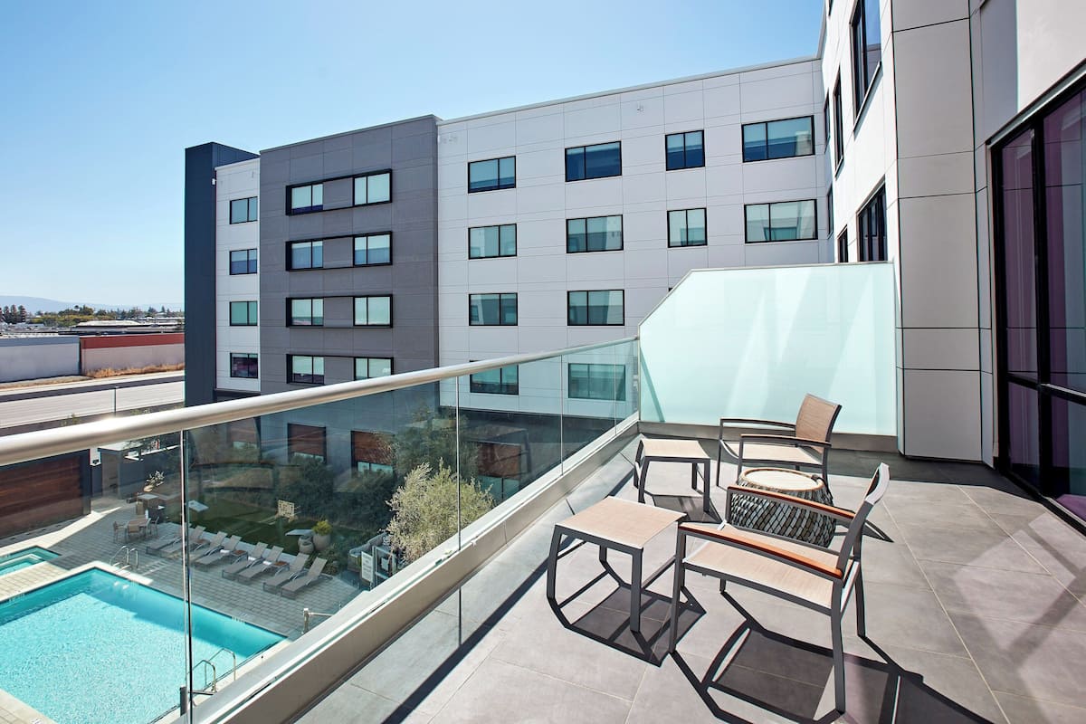 Suite, 1 King Bed with Sofa bed, Balcony | In-room safe, desk, laptop workspace, soundproofing