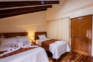 Family Triple Room, Multiple Beds | 20 bedrooms, in-room safe, iron/ironing board, free WiFi - Quechua Hostal de Recoleta (Cusco)