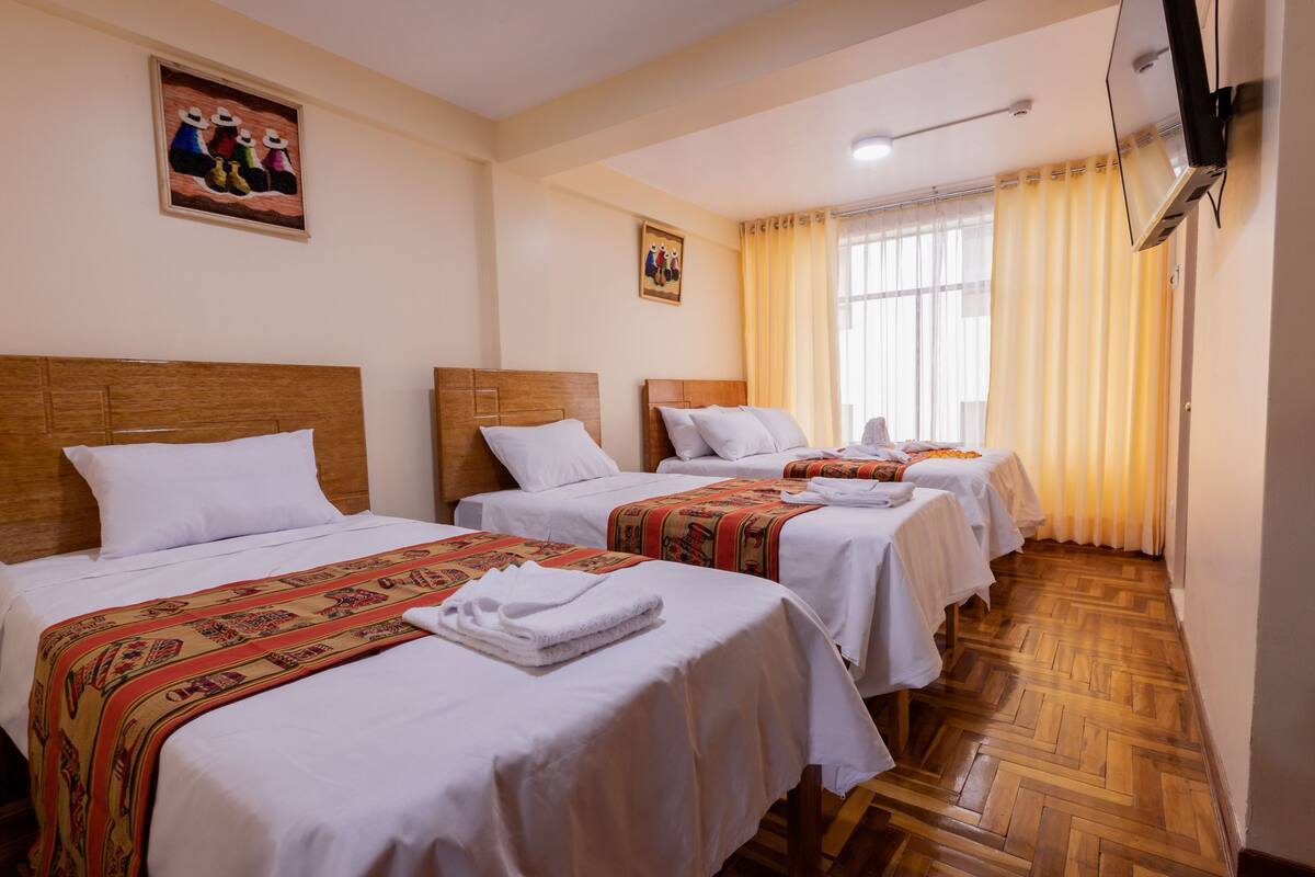 Chambre Triple, 3 lits une place