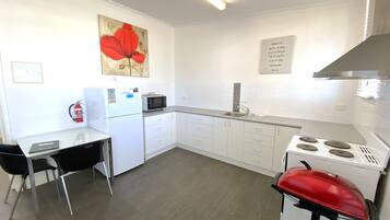 Fridge, microwave, toaster, cookware/dishes/utensils