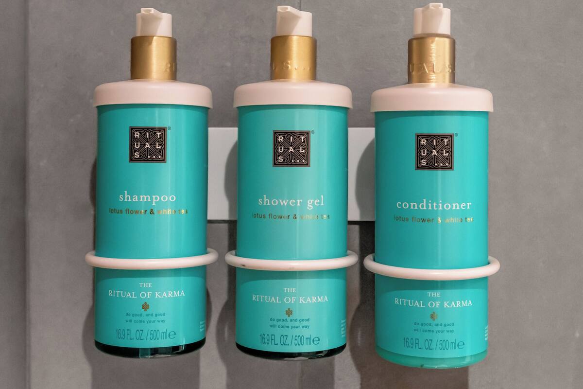 eco-friendly toiletries, hair dryer, slippers, towels