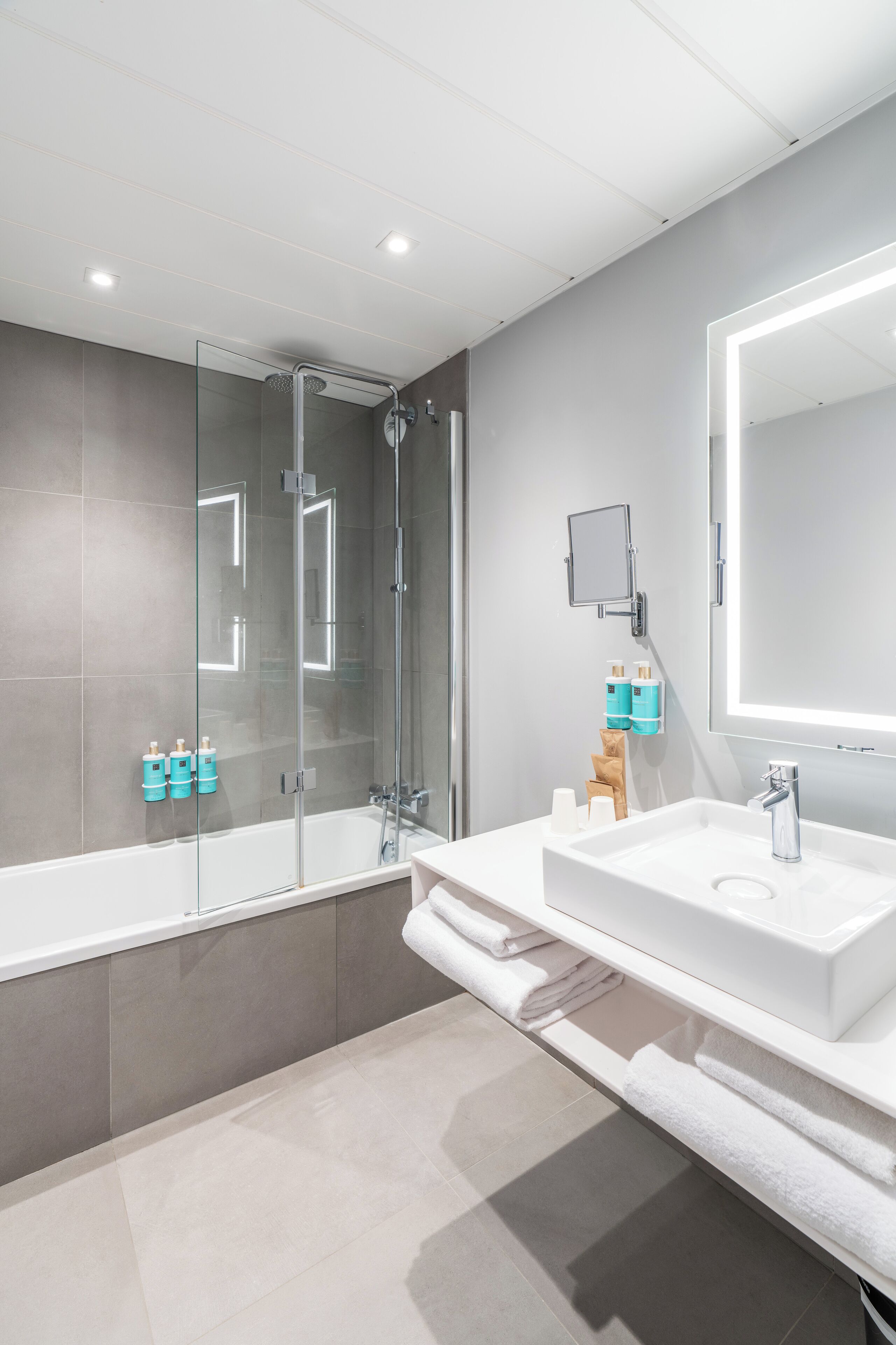 eco-friendly toiletries, hair dryer, slippers, towels