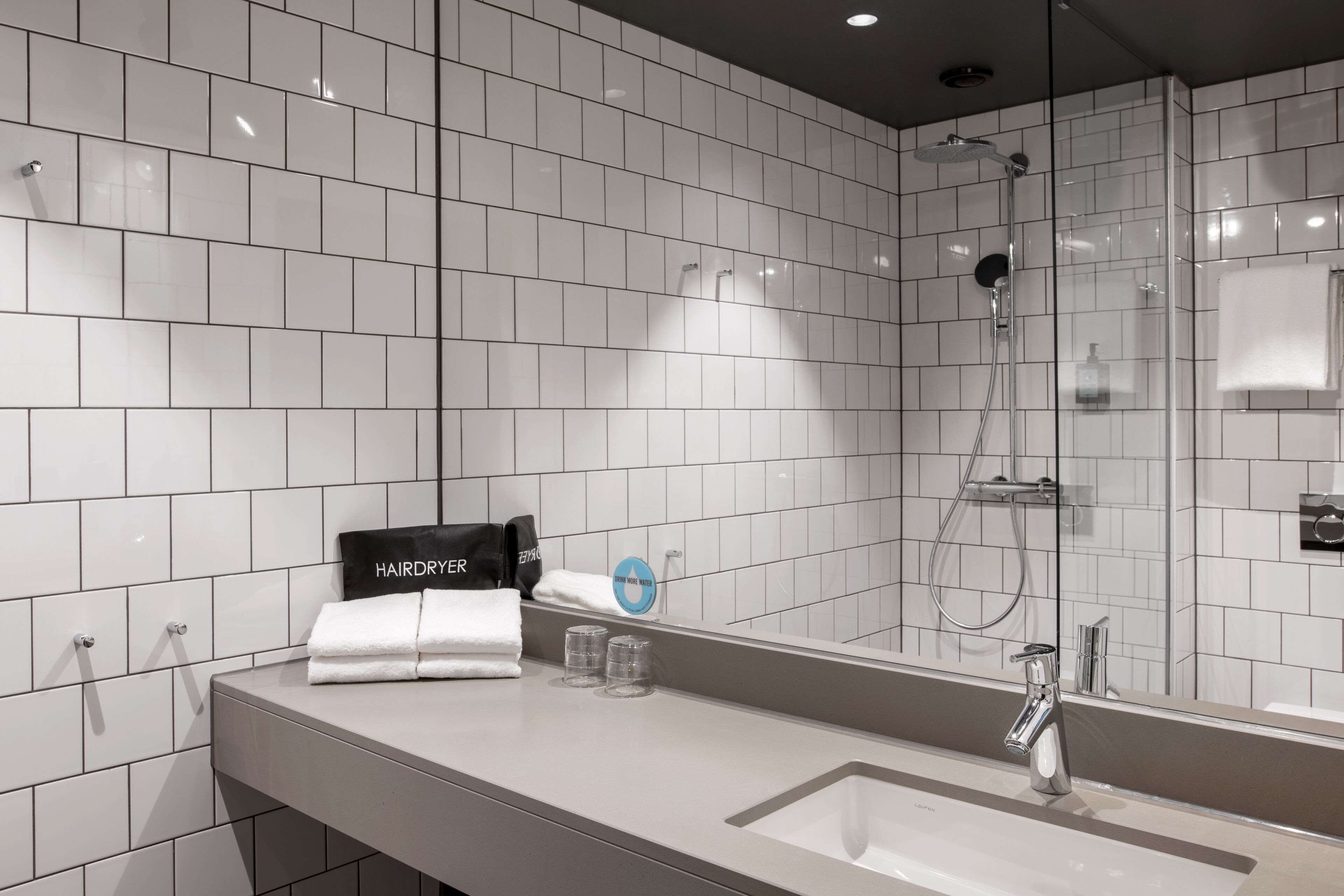 shower, rainfall showerhead, hair dryer, towels