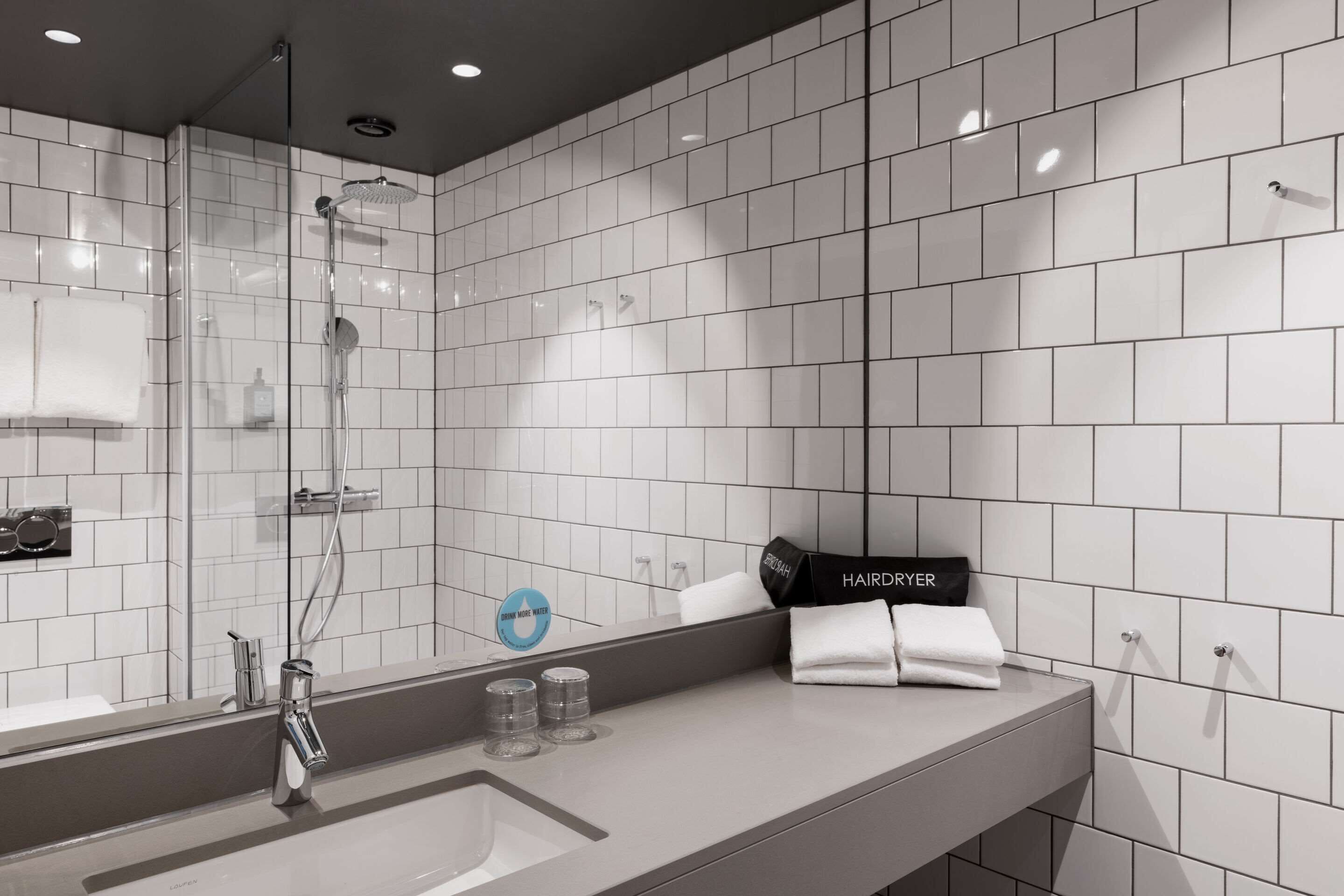 shower, rainfall showerhead, hair dryer, towels