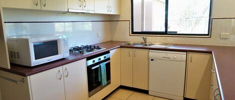 Fridge, microwave, cookware/dishes/utensils