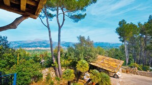 A rustic stone building with a tiled roof, surrounded by pine trees and a view of distant mountains and a town. - SON DURI (CIMENTERES) - Villa with private pool in Inca. Free WiFi (Selva)