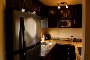 Condo, 1 Bedroom | Private kitchen | Fridge, cookware/dishes/utensils