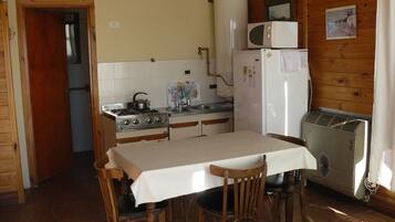 Cabin | Private kitchen | Full-sized fridge, microwave, cookware/dishes/utensils