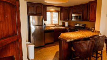 Condo, 2 Bedrooms | Private kitchen | Oven, stovetop